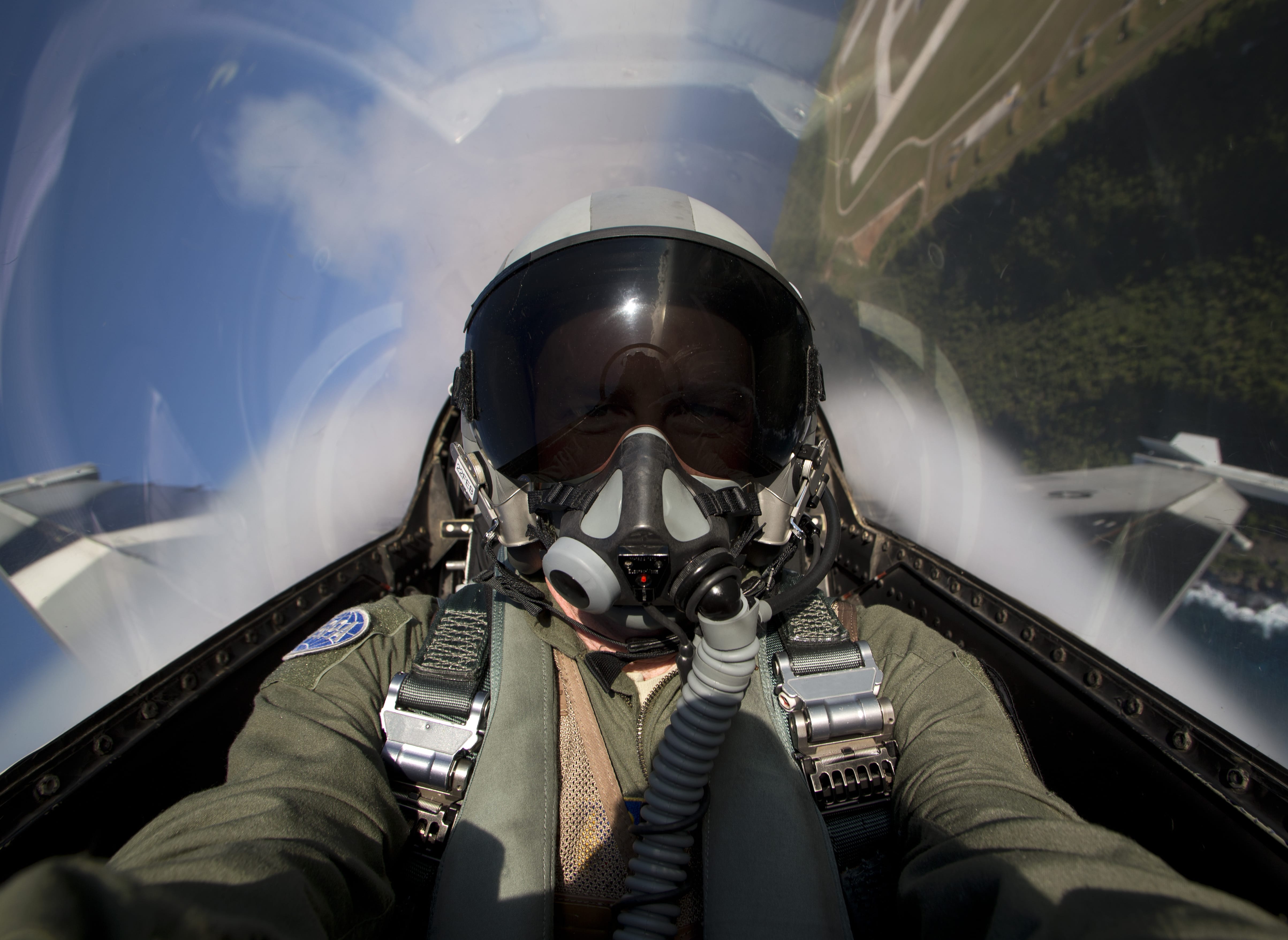 Pilot with a mask in a jet